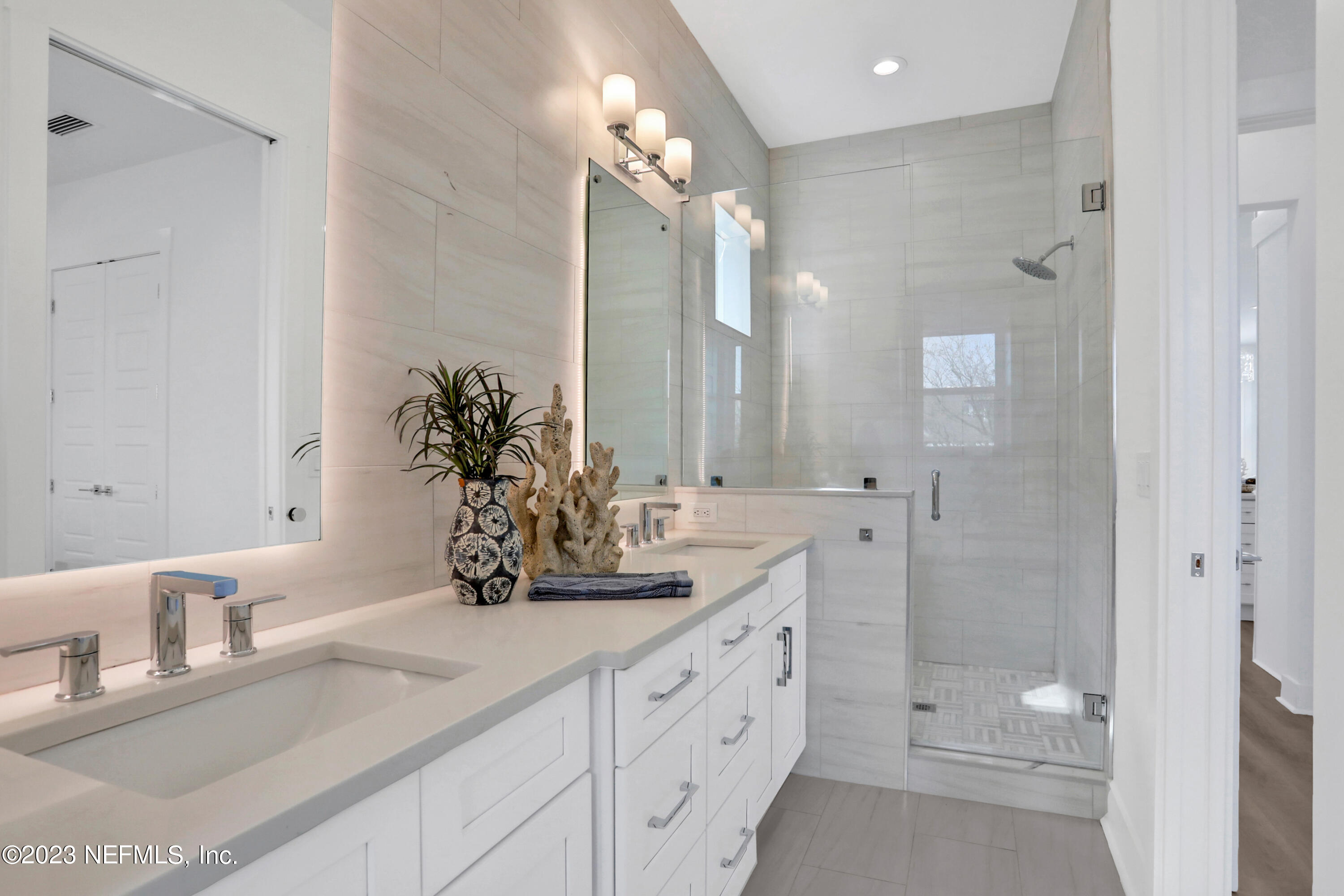 2107 Gordon Avenue Jacksonville Beach, FL 32250 - Photo 32 of 36 a bathroom with a double vanity sink mirror and shower