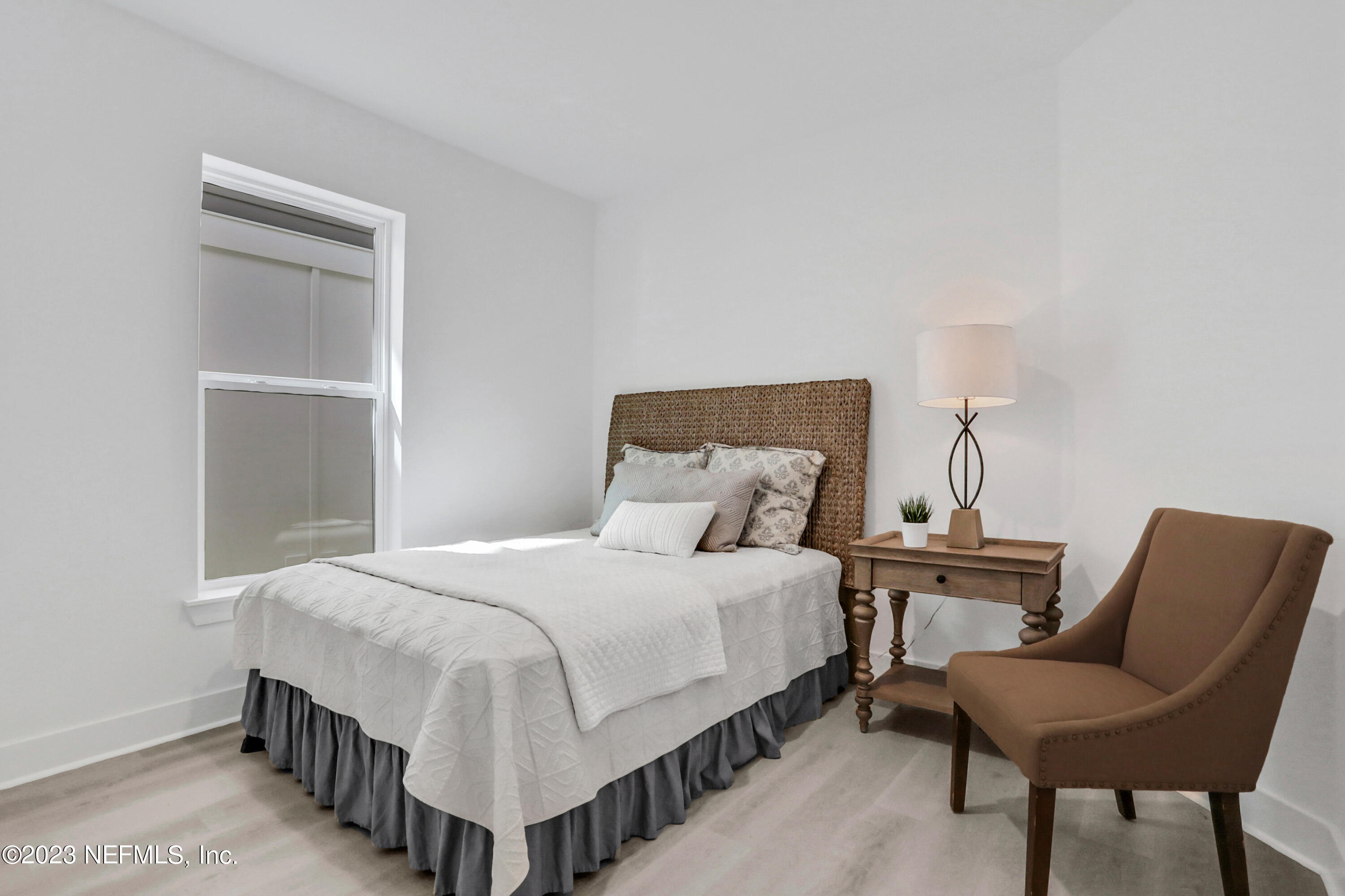 2107 Gordon Avenue Jacksonville Beach, FL 32250 - Photo 6 of 36 a bedroom with a bed and a chair
