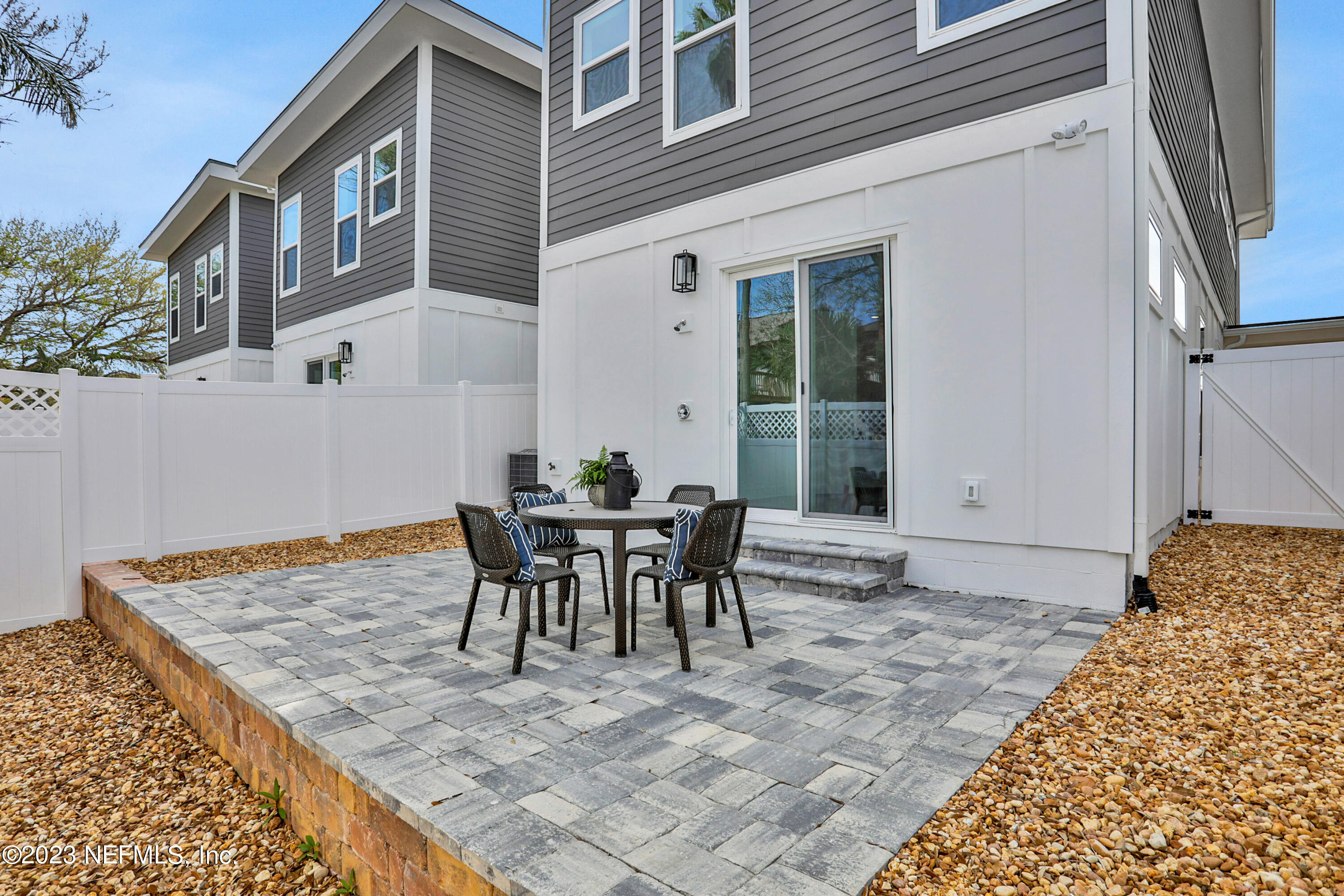 2107 Gordon Avenue Jacksonville Beach, FL 32250 - Photo 10 of 36 a backyard of a house with table and chairs