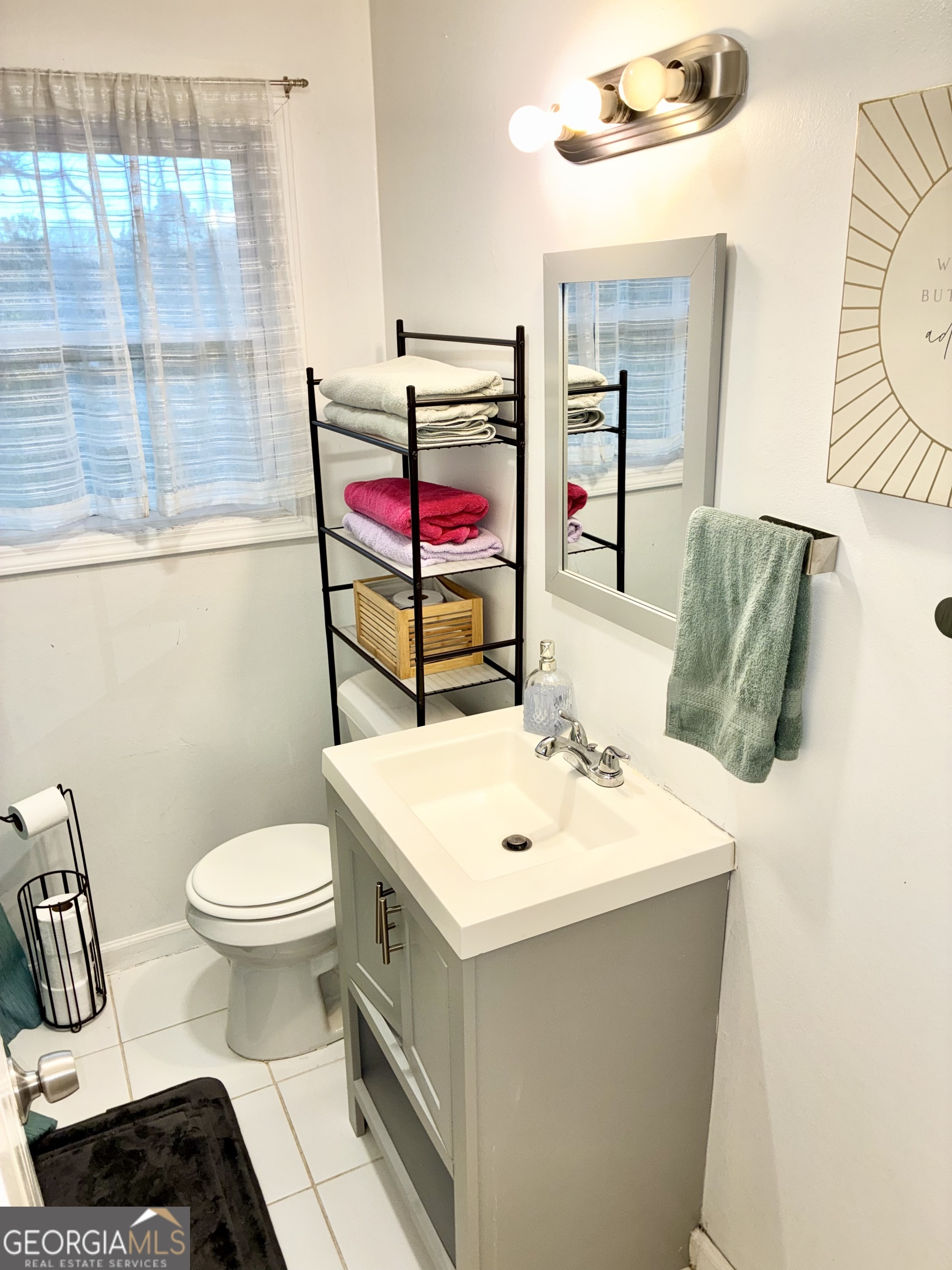 1859 Williams Avenue East Point, GA 30344 - Photo 11 of 20 a bathroom with a sink toilet and vanity
