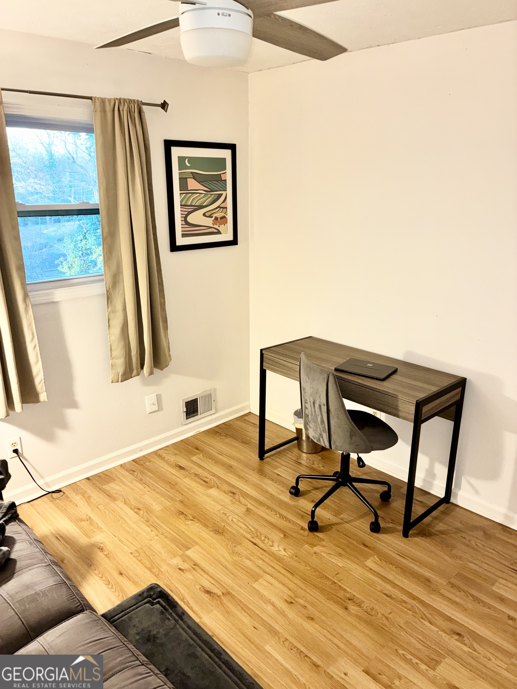 1859 Williams Avenue East Point, GA 30344 - Photo 13 of 20 a view of a workspace with furniture and a window