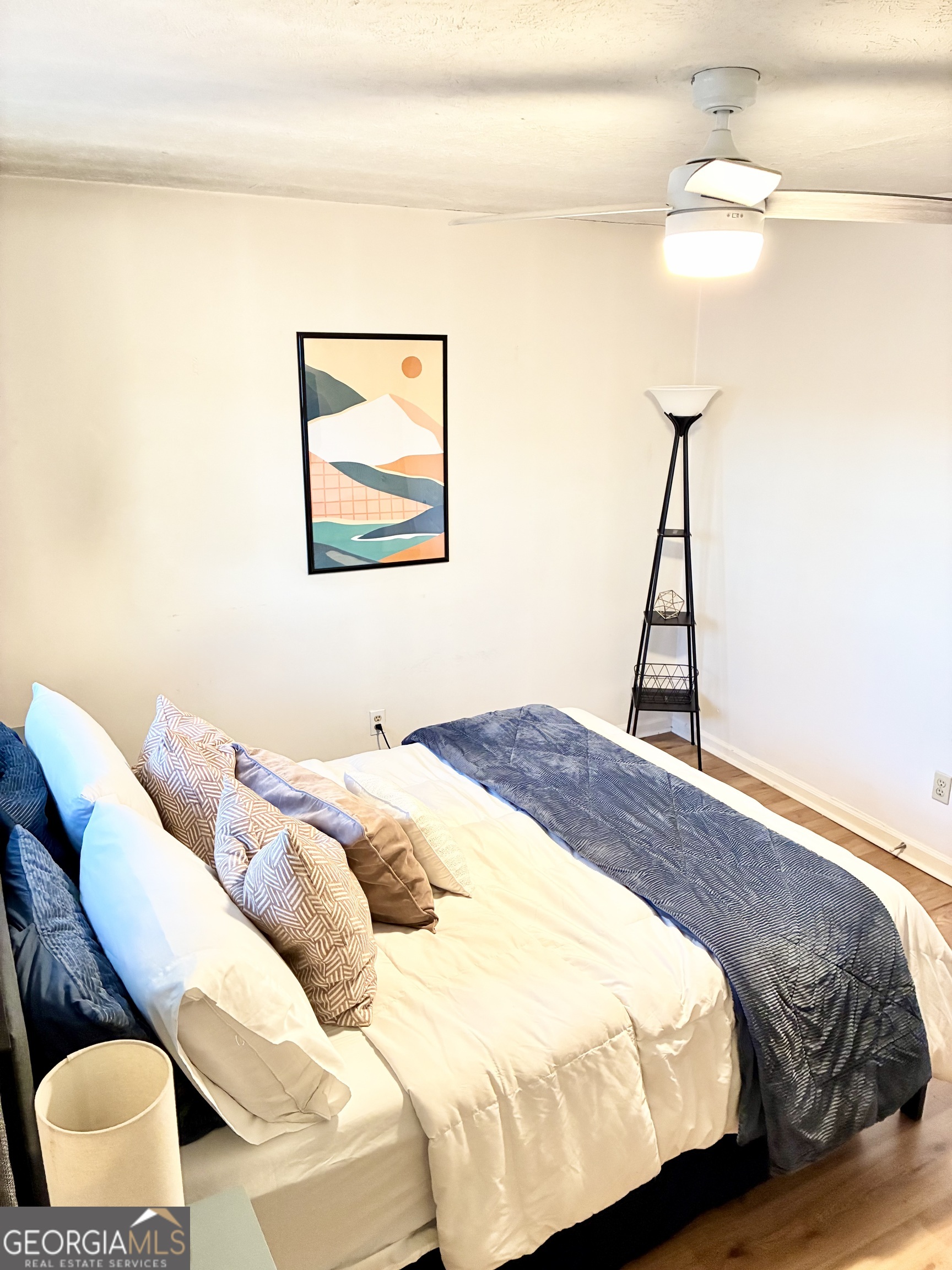 1859 Williams Avenue East Point, GA 30344 - Photo 17 of 20 a bedroom with a bed and a painting on the wall