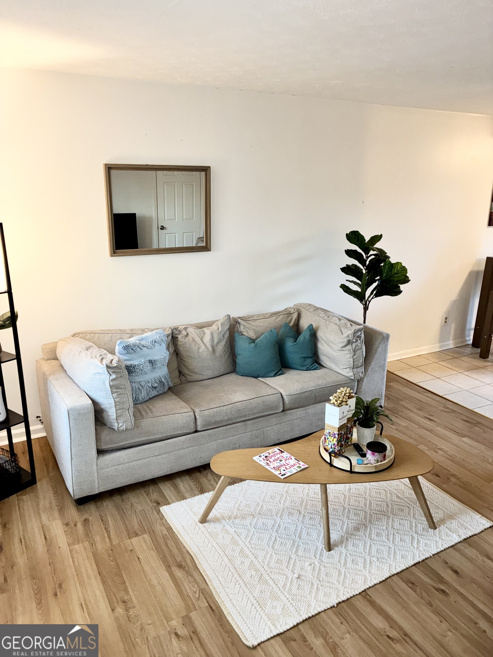 1859 Williams Avenue East Point, GA 30344 - Photo 2 of 20 a living room with furniture and a potted plant