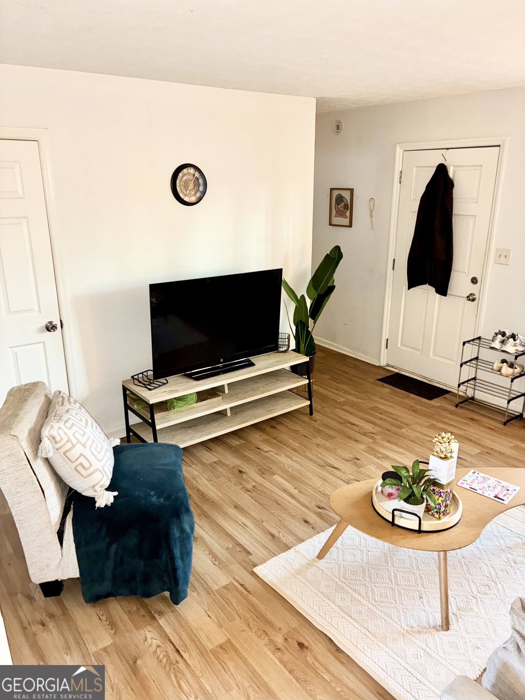 1859 Williams Avenue East Point, GA 30344 - Photo 4 of 20 a living room with furniture and a flat screen tv