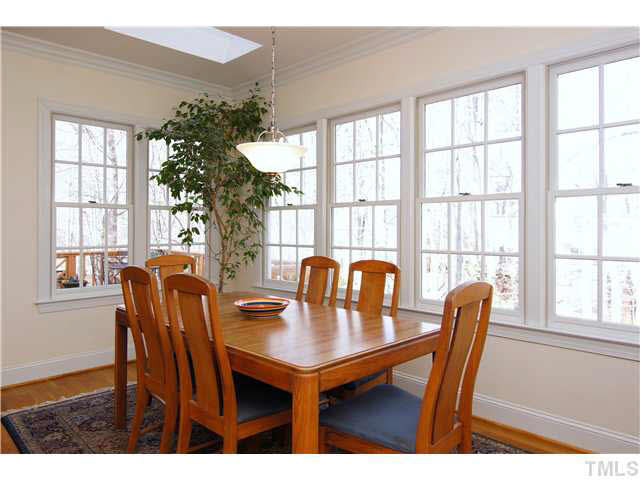 7017 Spring Ridge Road Cary, NC 27518 - Photo 4 of 25 Bright & sunny Breakfast room overlooks private backyard and is a great spot for casual dining. Breakfast Area