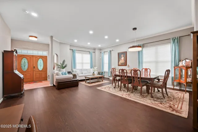 a large kitchen with stainless steel appliances granite countertop a sink and cabinets