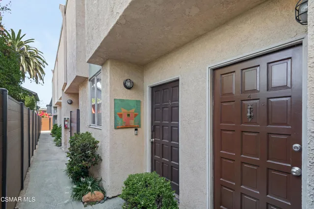 a car parked in front of white house
