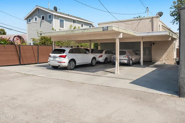 an aerial view of residential houses with city view