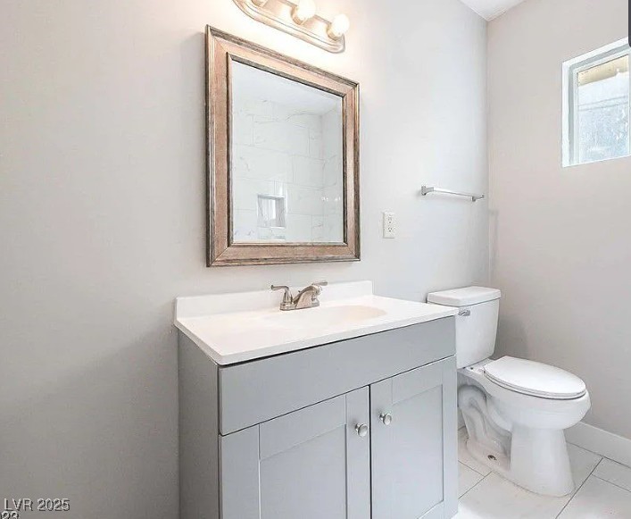 239 West Cleveland Avenue, Unit 1 Las Vegas, NV 89102 - Photo 6 of 12 Half bath with vanity and light tile patterned floors