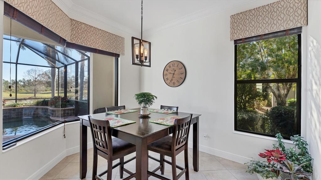 7833 Valderrama Way Lakewood Ranch, FL 34202 - Photo 16 of 63 a view of a dining room with furniture window and outside view