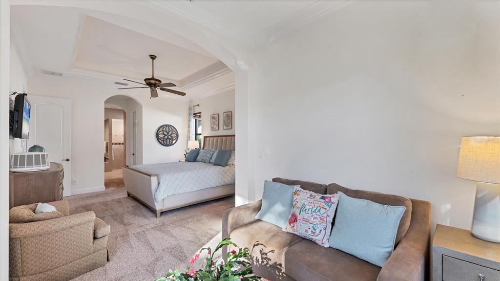 7833 Valderrama Way Lakewood Ranch, FL 34202 - Photo 19 of 63 a living room with furniture and a chandelier