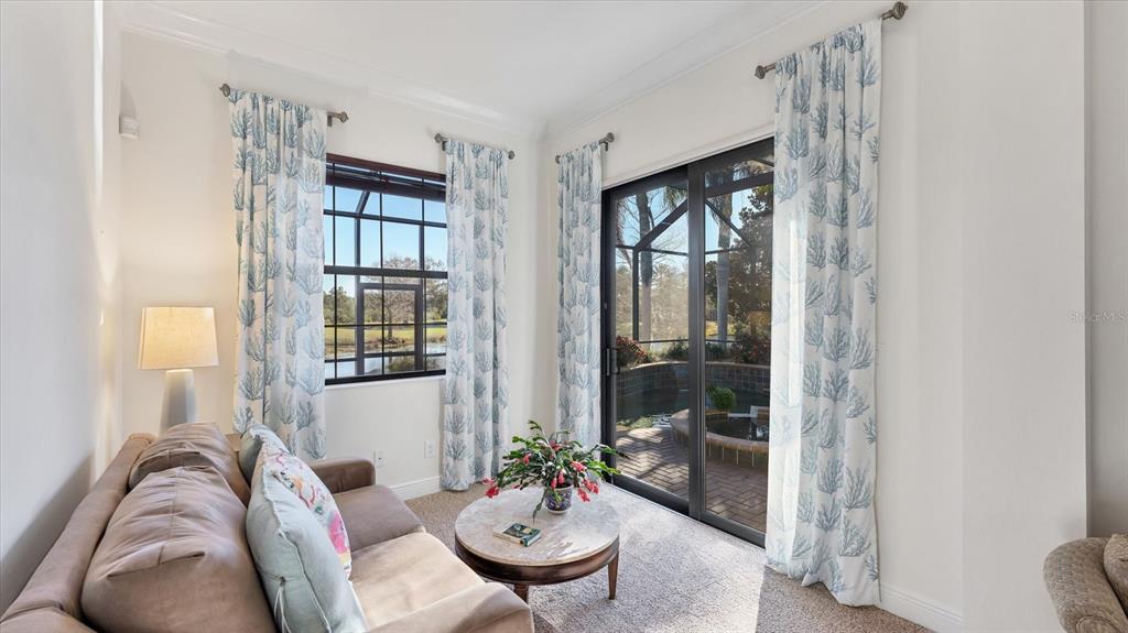 7833 Valderrama Way Lakewood Ranch, FL 34202 - Photo 20 of 63 a living room with furniture and a large window