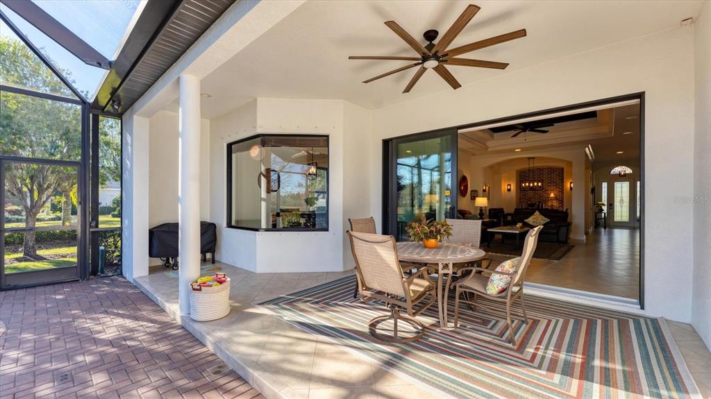 7833 Valderrama Way Lakewood Ranch, FL 34202 - Photo 33 of 63 a view of a dining room with furniture window and wooden floor