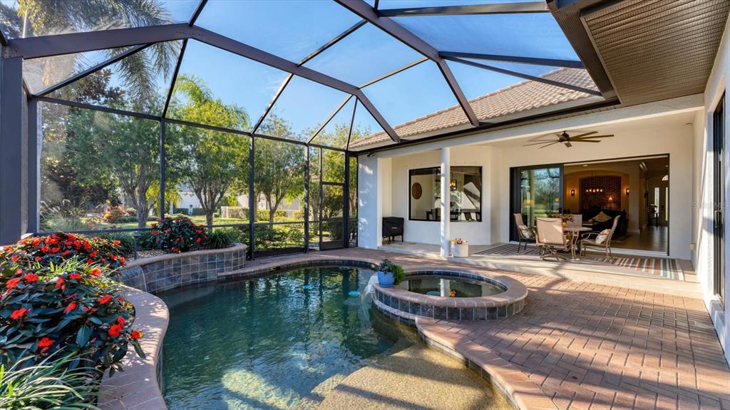 7833 Valderrama Way Lakewood Ranch, FL 34202 - Photo 36 of 63 a view of swimming pool with outdoor seating