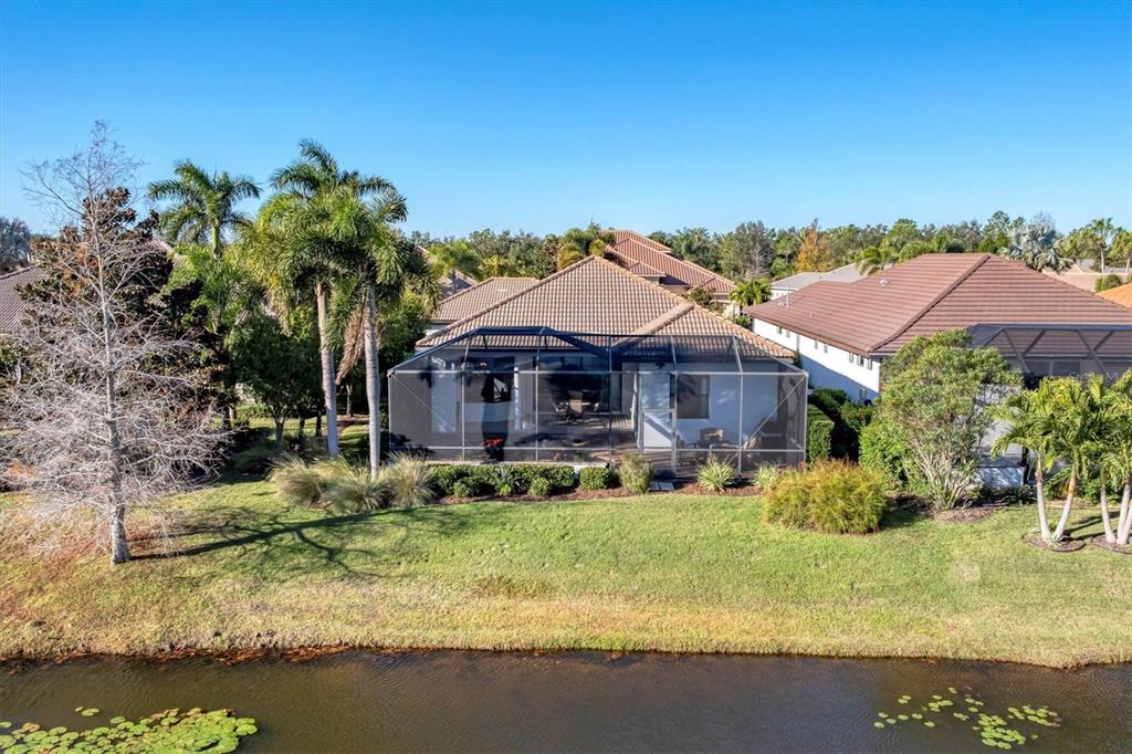 7833 Valderrama Way Lakewood Ranch, FL 34202 - Photo 41 of 63 a front view of house with yard and green space