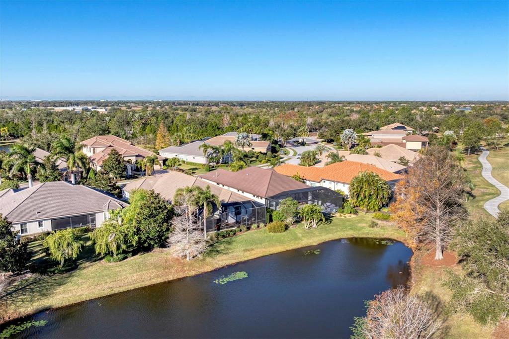 7833 Valderrama Way Lakewood Ranch, FL 34202 - Photo 42 of 63 an aerial view of residential houses with outdoor space
