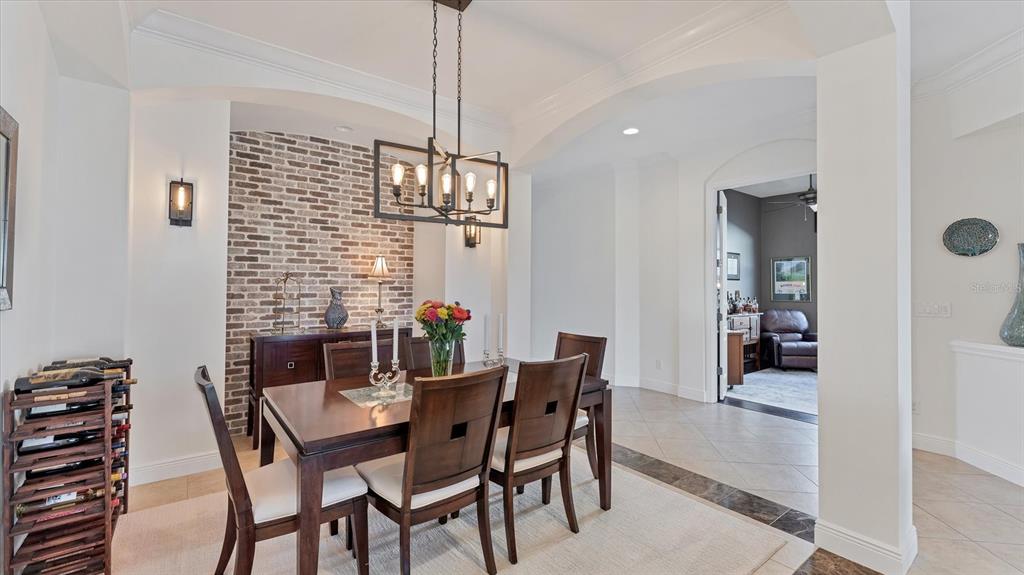 7833 Valderrama Way Lakewood Ranch, FL 34202 - Photo 8 of 63 a dining room with furniture and window