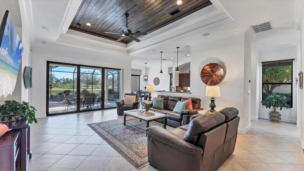 7833 Valderrama Way Lakewood Ranch, FL 34202 - Photo 9 of 63 a living room with furniture and a large window