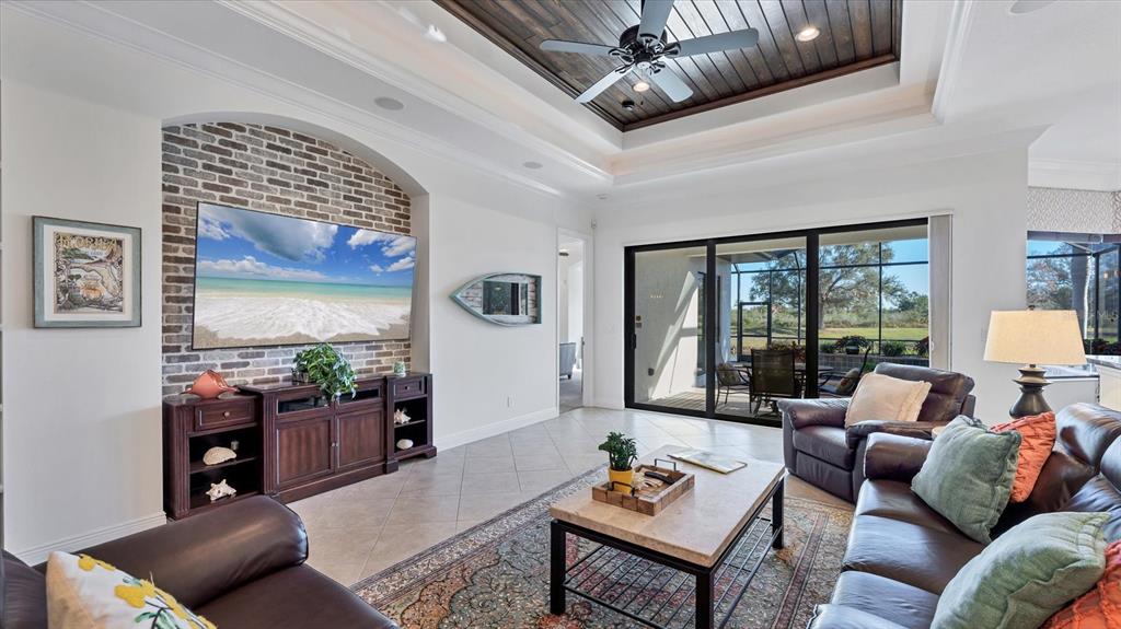 7833 Valderrama Way Lakewood Ranch, FL 34202 - Photo 10 of 63 a living room with furniture and a large window