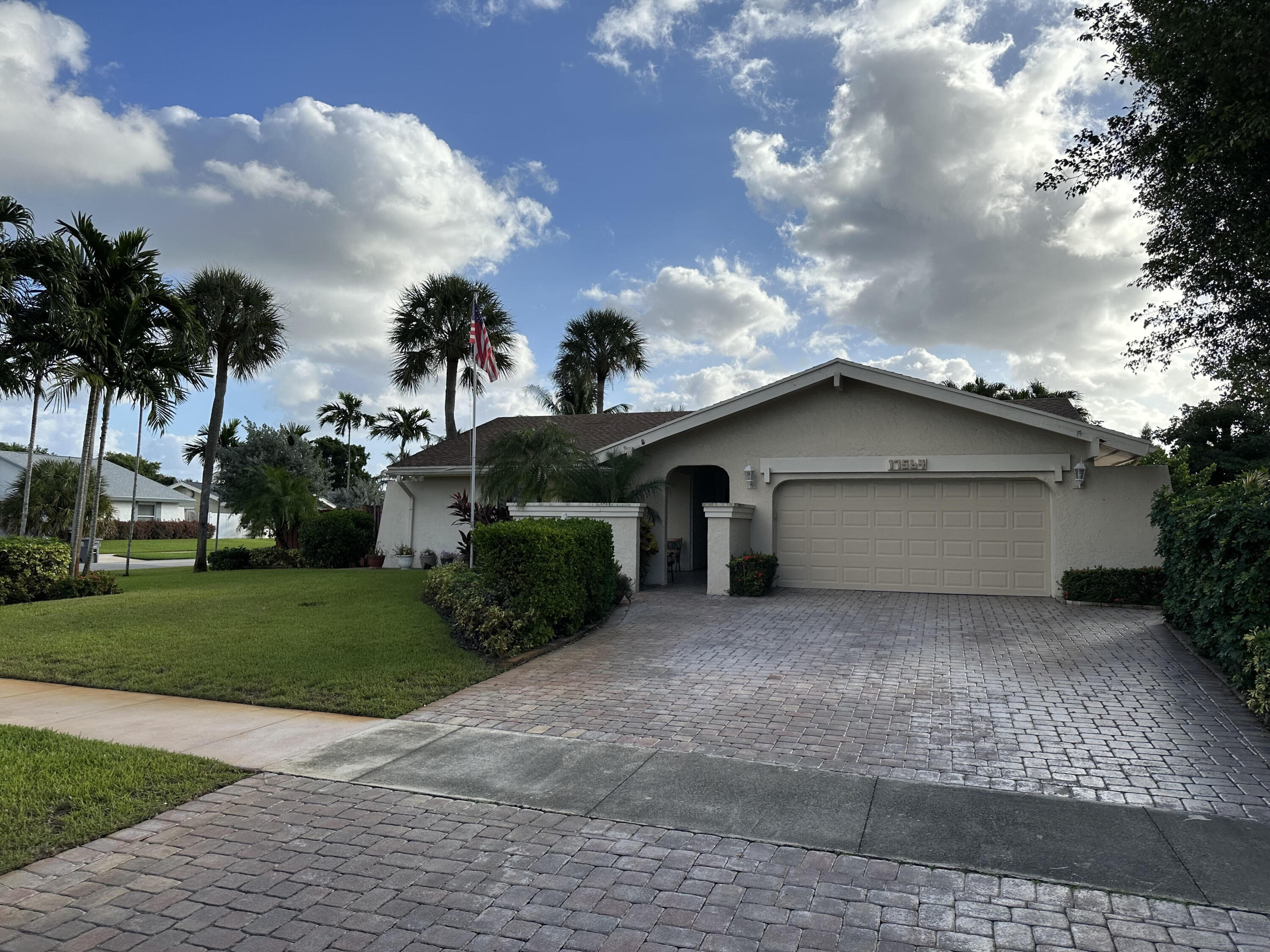 17564 Weeping Willow Trail Boca Raton, FL 33487 - Photo 1 of 2 a front view of house with yard and green space