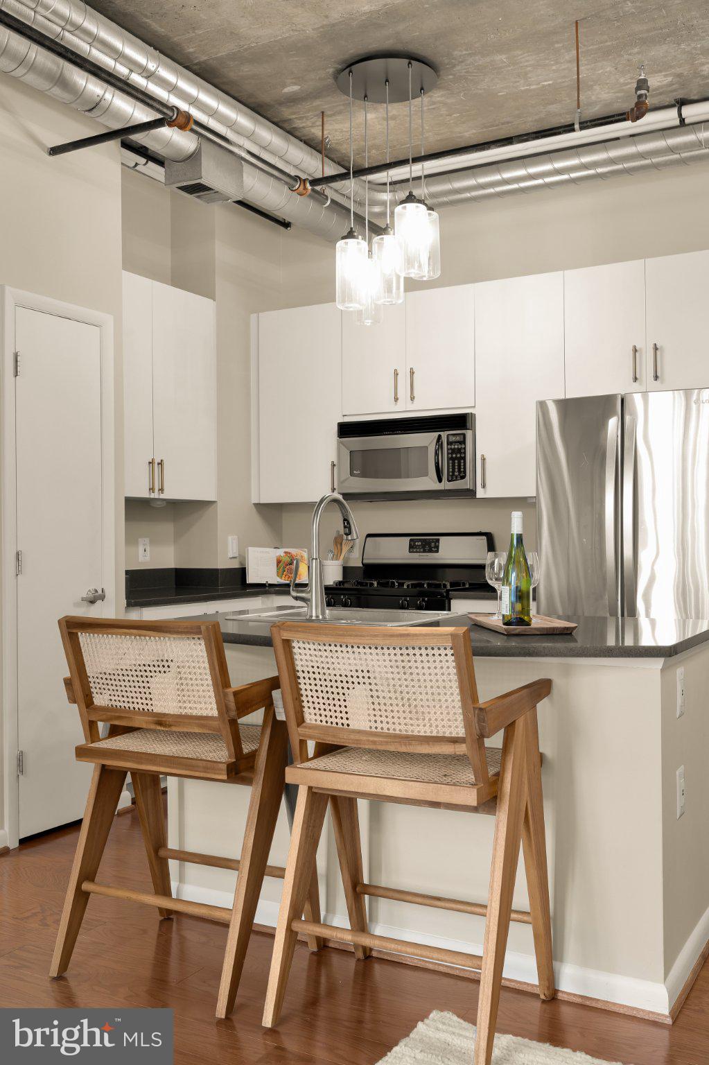 1300 N Street Northwest, Unit 809 Washington, DC 20005 - Photo 14 of 27 Sleek urban kitchen with modern flair.