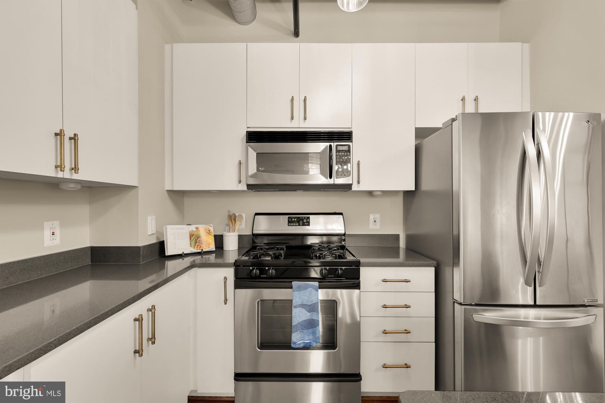 1300 N Street Northwest, Unit 809 Washington, DC 20005 - Photo 15 of 27 Sleek modern kitchen with stainless steel.