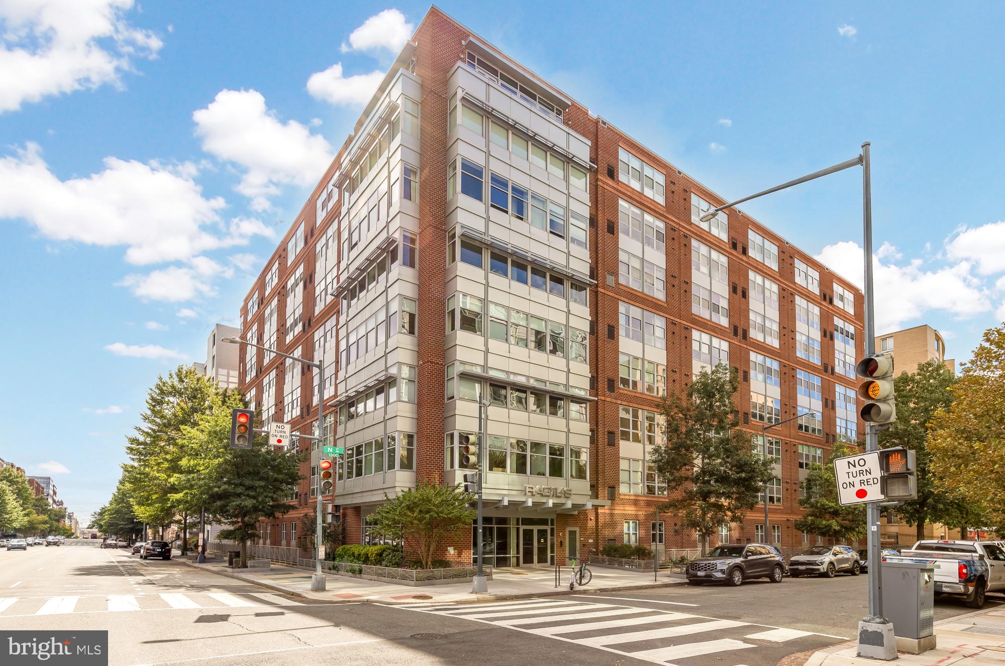 1300 N Street Northwest, Unit 809 Washington, DC 20005 - Photo 26 of 27 Modern urban building with vibrant skies.