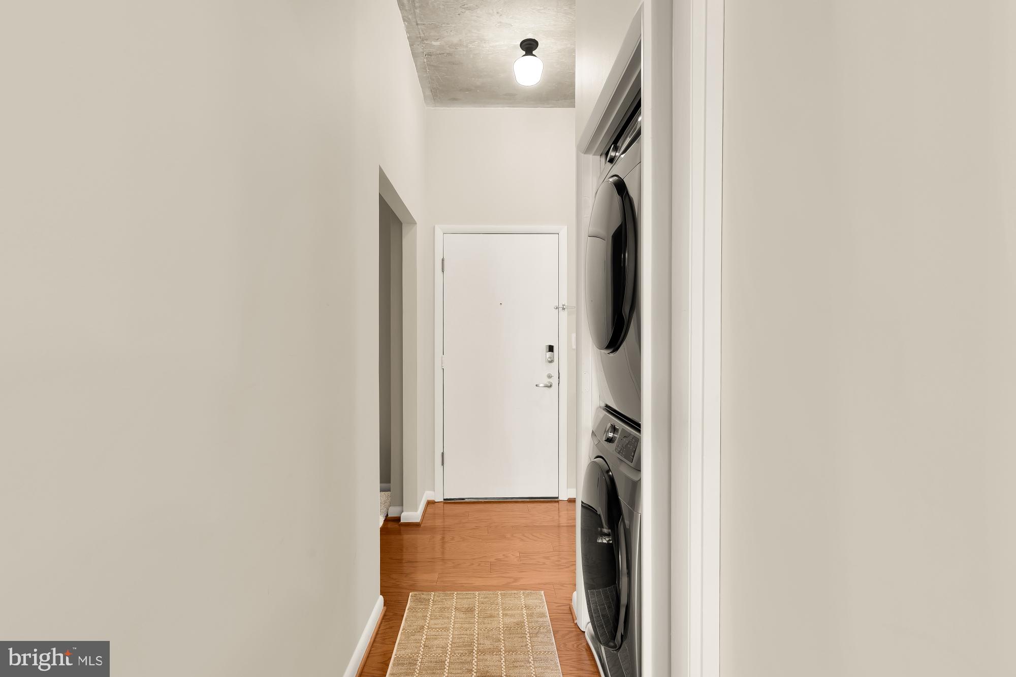 1300 N Street Northwest, Unit 809 Washington, DC 20005 - Photo 5 of 27 Modern hallway with laundry convenience.