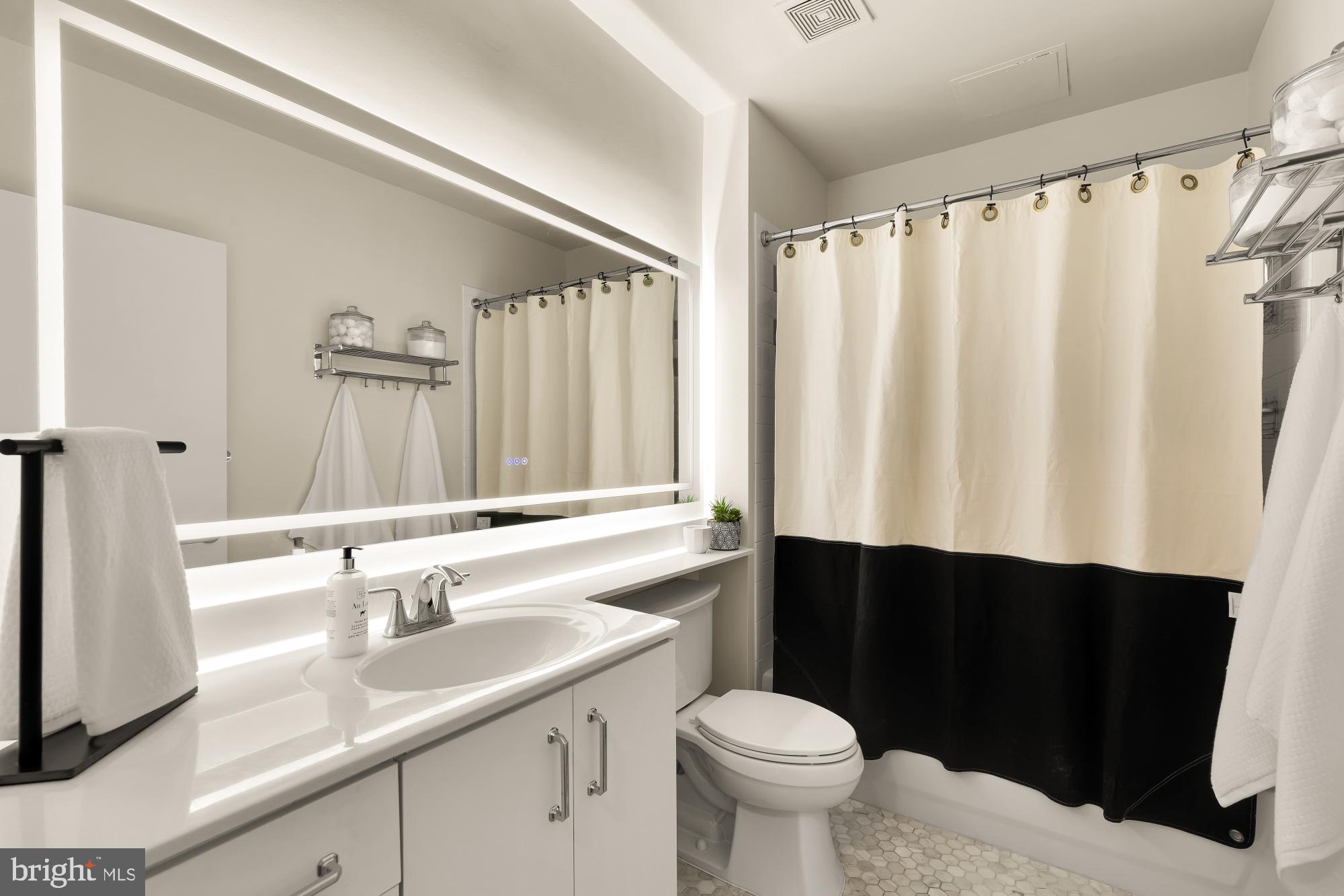 1300 N Street Northwest, Unit 809 Washington, DC 20005 - Photo 9 of 27 Sleek modern bathroom with elegant touches.