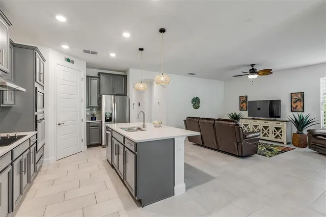 a view of a house with swimming pool and sitting area