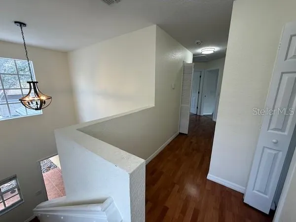 a view of entryway with wooden floor