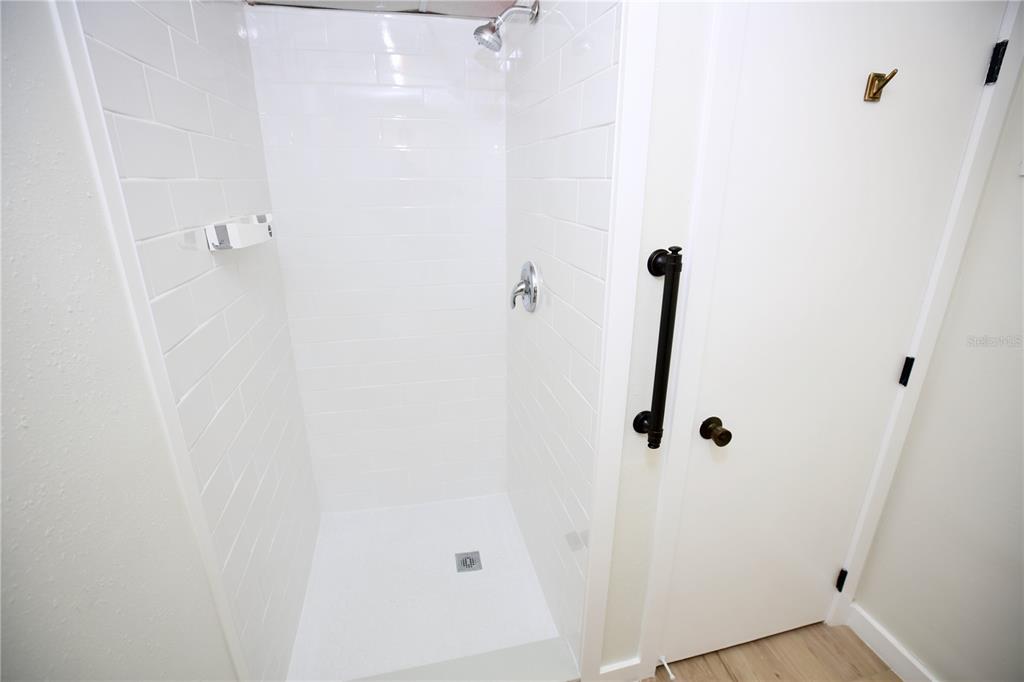 11702 Raintree Village Boulevard, Unit B Temple Terrace, FL 33617 - Photo 21 of 38 a bathroom with a shower