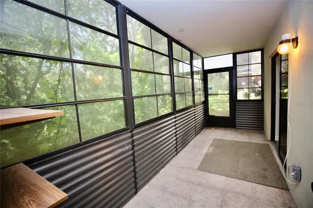 a view of a balcony with wooden floor