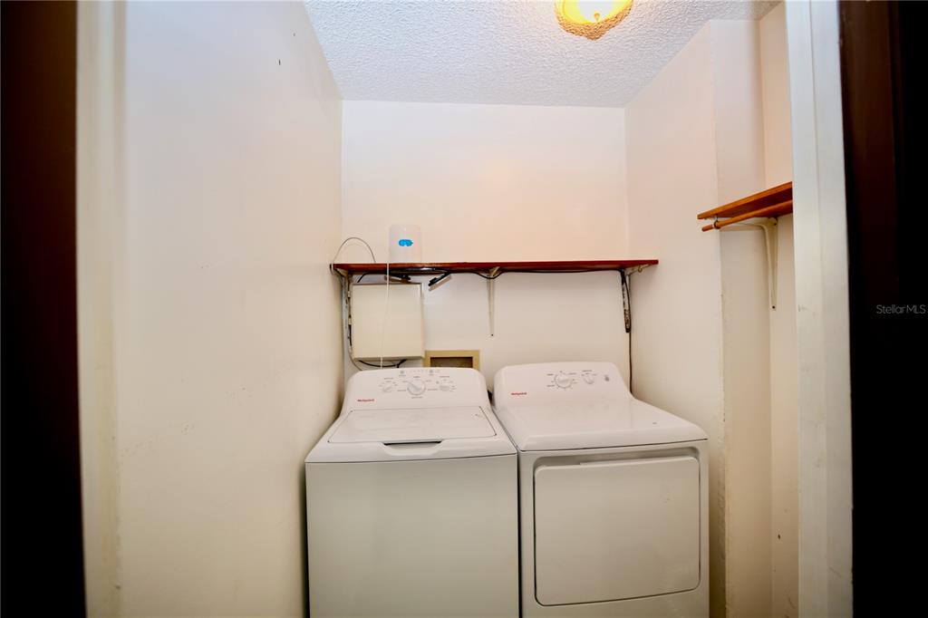 11702 Raintree Village Boulevard, Unit B Temple Terrace, FL 33617 - Photo 24 of 38 a utility room with dryer and washer