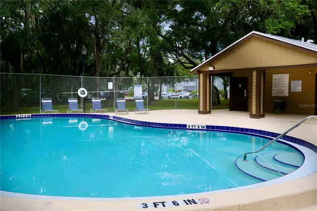a view of a house with swimming pool