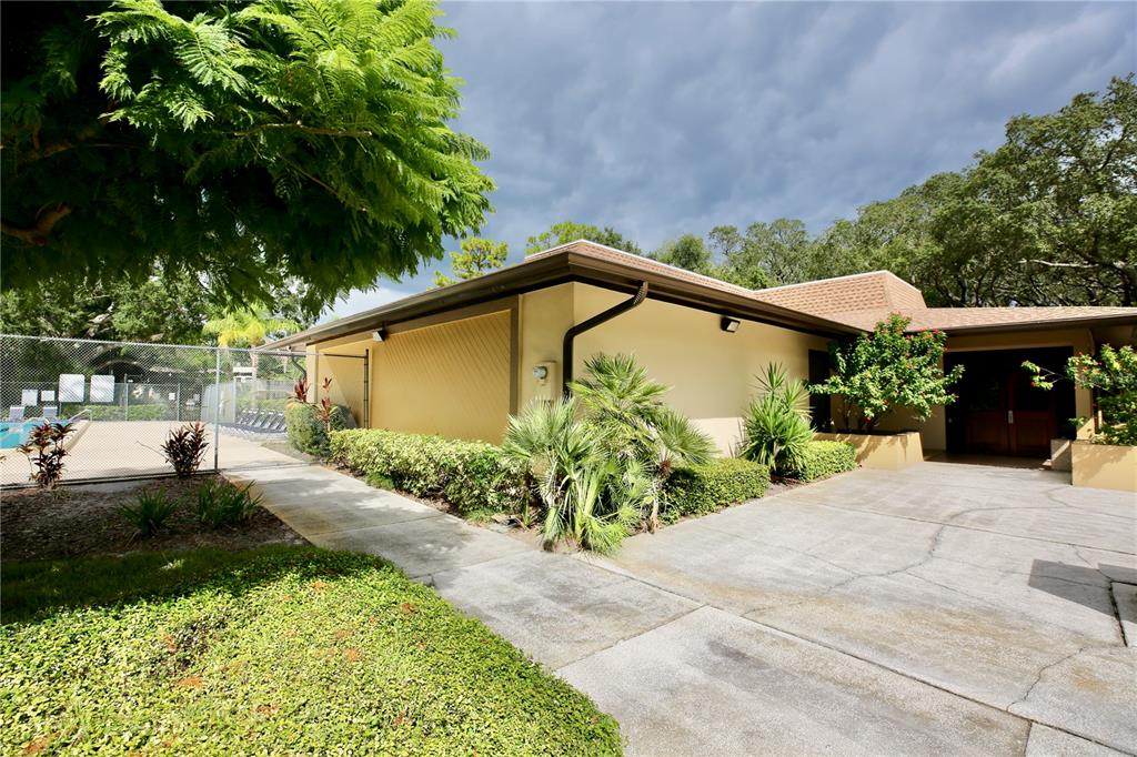 11702 Raintree Village Boulevard, Unit B Temple Terrace, FL 33617 - Photo 28 of 38 a view of a back yard of the house