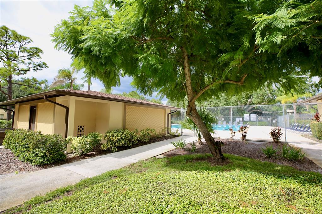 11702 Raintree Village Boulevard, Unit B Temple Terrace, FL 33617 - Photo 29 of 38 a view of backyard of house with green space