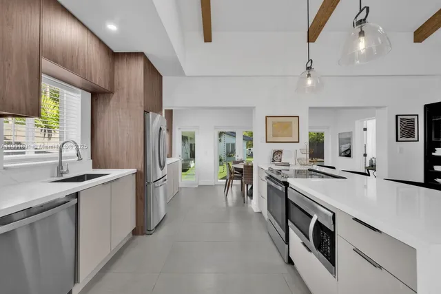 a bathroom with a double vanity sink mirror and shower