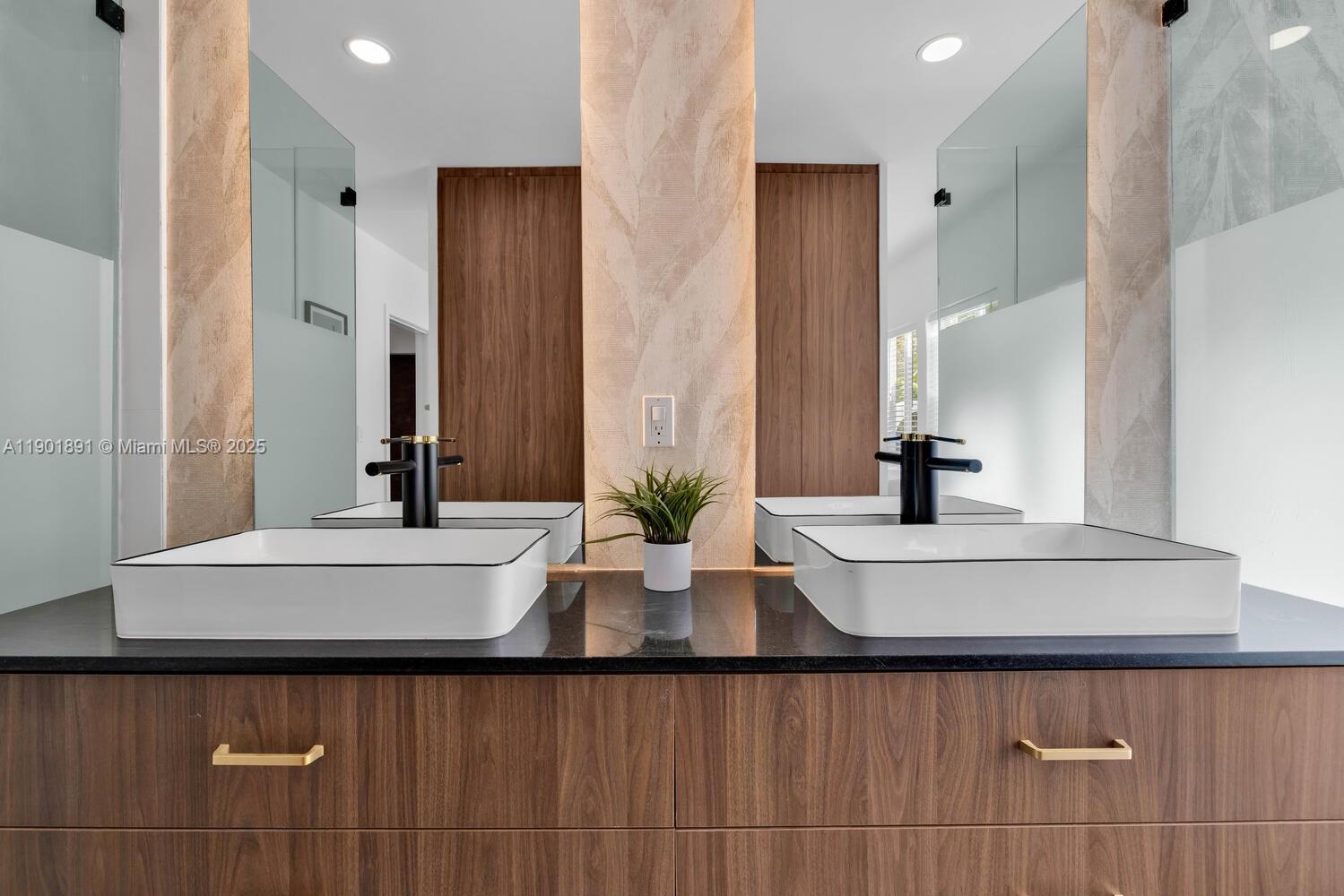 901 Northwest 7th Street Miami, FL 33136 - Photo 21 of 98 a bathroom with a double vanity sink and a mirror