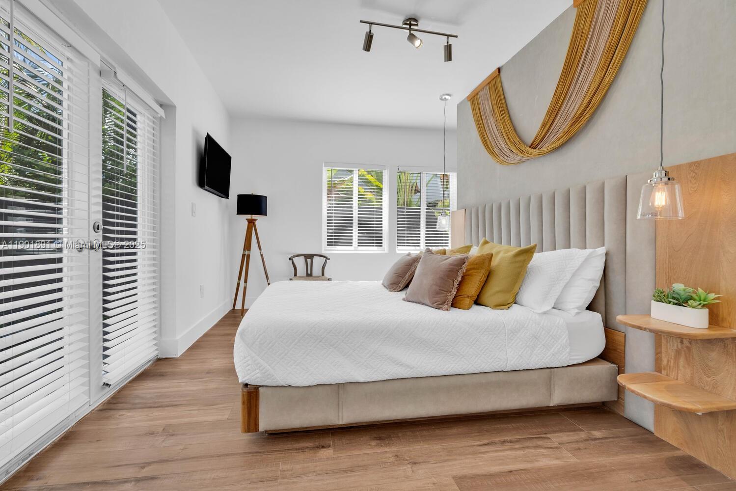 901 Northwest 7th Street Miami, FL 33136 - Photo 24 of 98 a bedroom with a large bed and a window