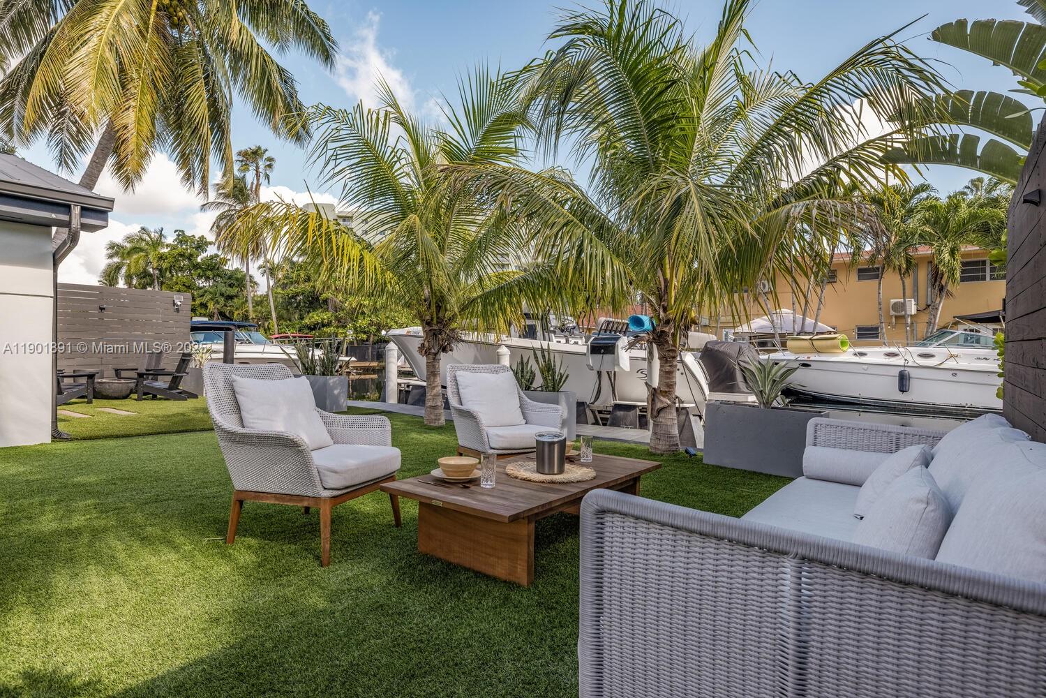 901 Northwest 7th Street Miami, FL 33136 - Photo 52 of 98 a view of a backyard with a patio table and chairs