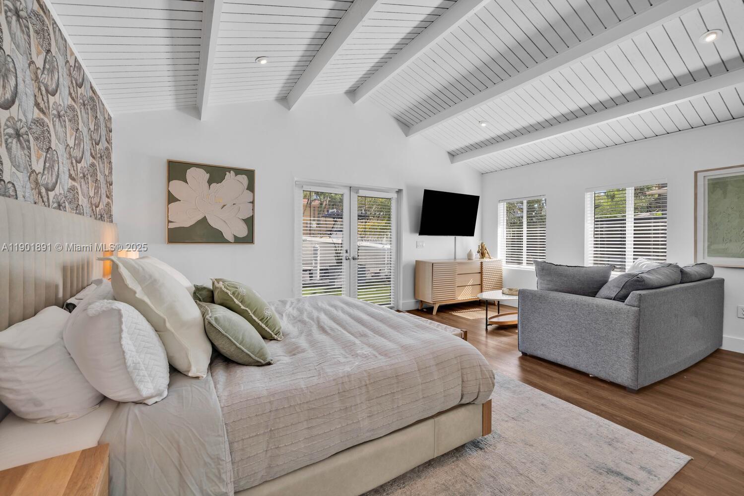 901 Northwest 7th Street Miami, FL 33136 - Photo 59 of 98 a bedroom with furniture and a flat screen tv