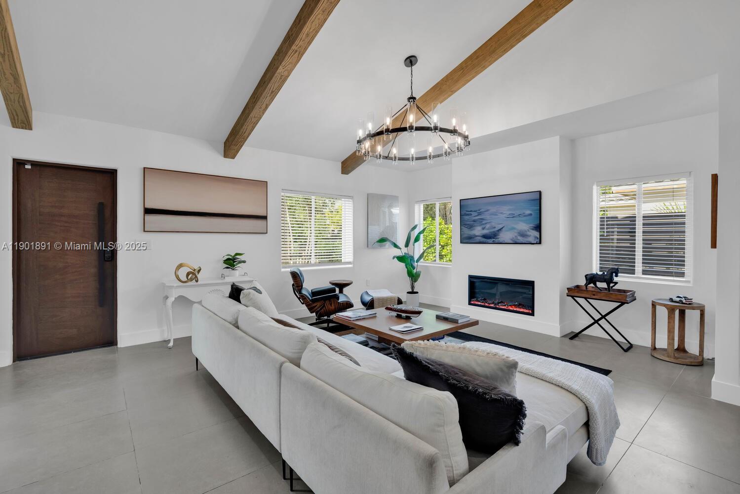 901 Northwest 7th Street Miami, FL 33136 - Photo 7 of 98 a living room with furniture a fireplace and a flat screen tv