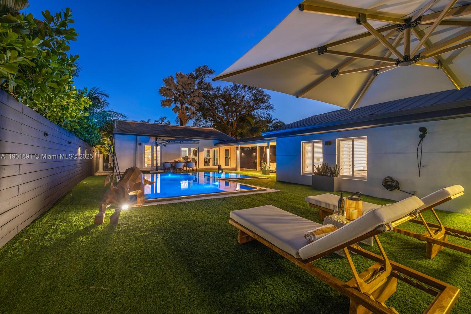 901 Northwest 7th Street Miami, FL 33136 - Photo 73 of 98 a view of a house with pool and chairs