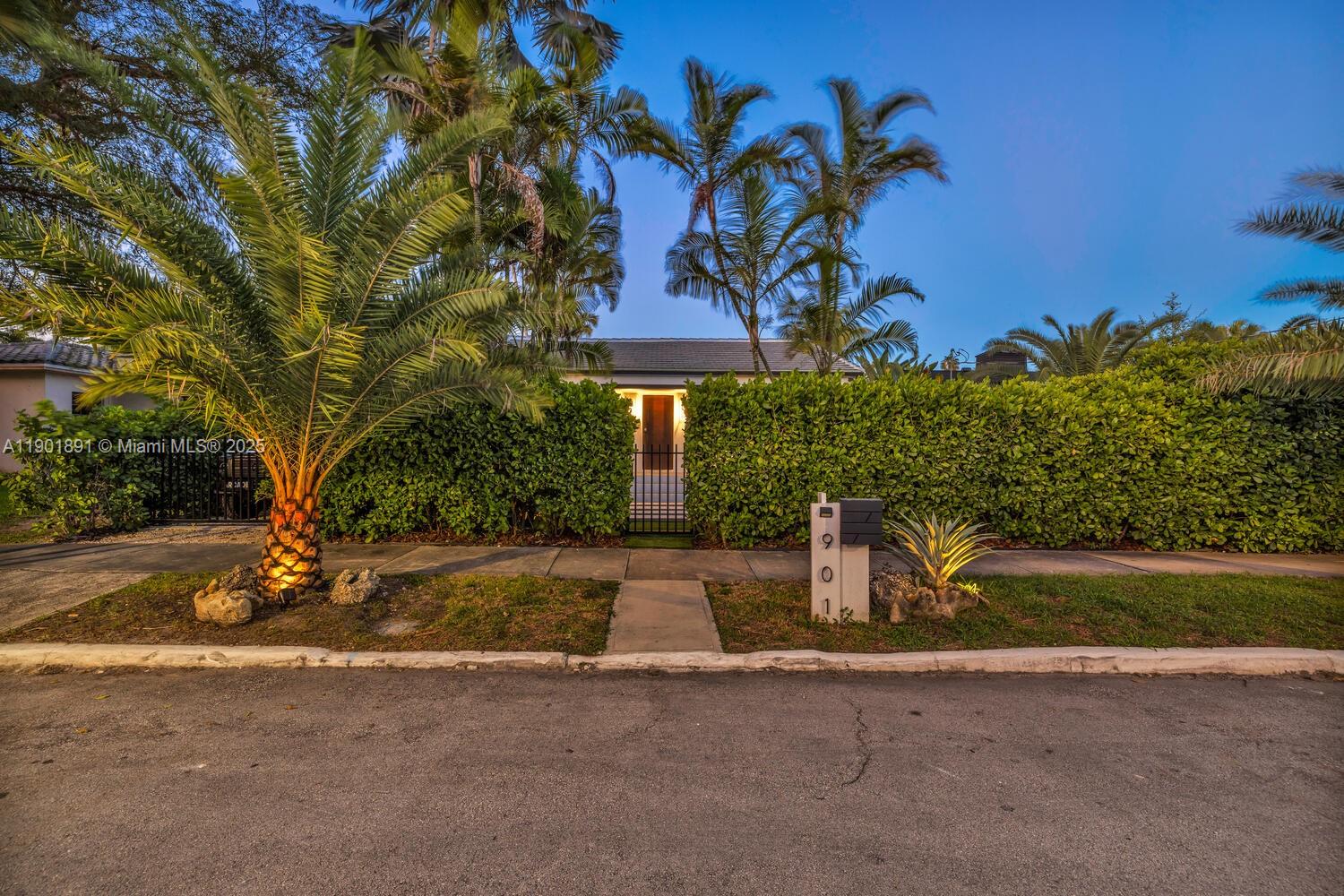 901 Northwest 7th Street Miami, FL 33136 - Photo 90 of 98 a front view of a house with a yard and garage