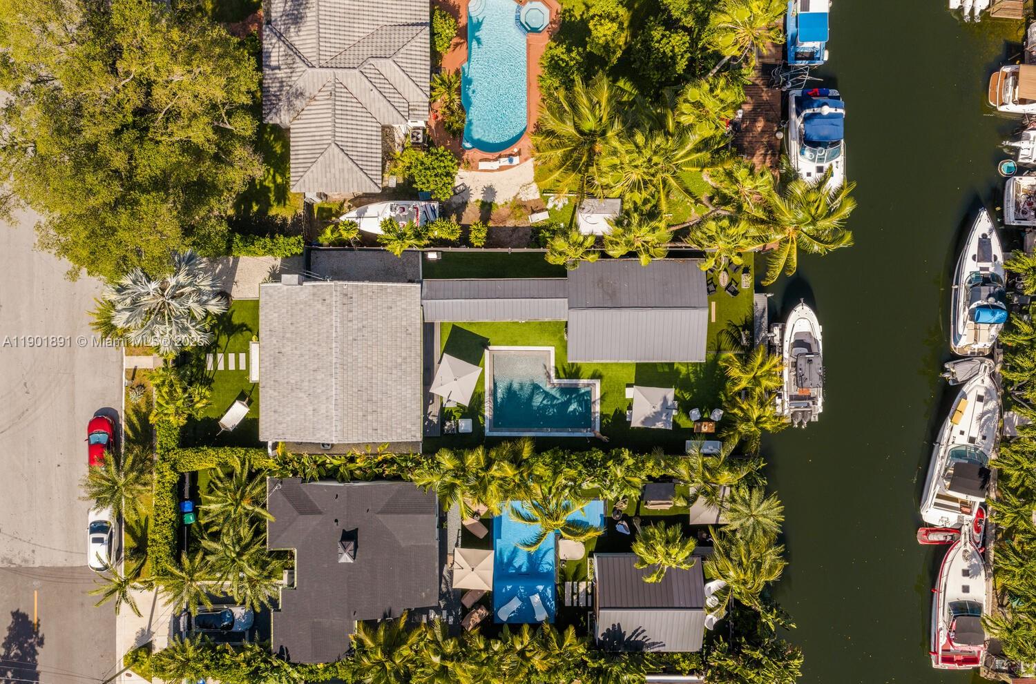 901 Northwest 7th Street Miami, FL 33136 - Photo 91 of 98 aerial view of a house with a yard and large trees