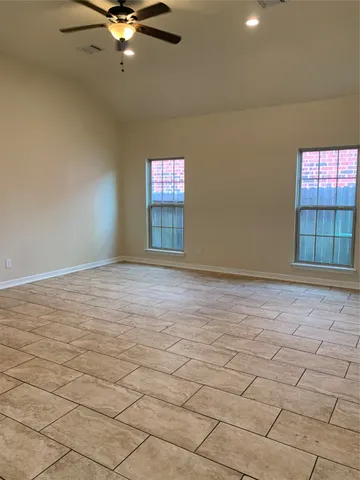a view of an empty room with a window