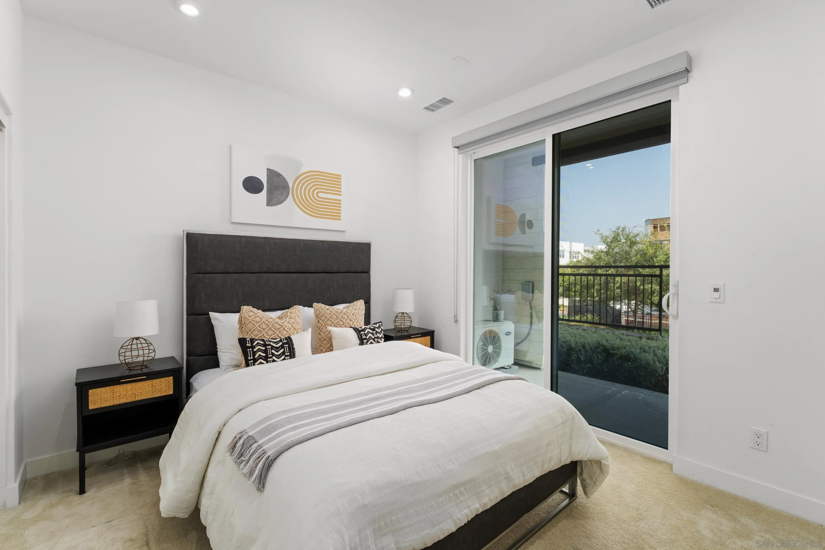 2731 Via Avella San Diego, CA 92108 - Photo 15 of 39 a bedroom with a bed and a window