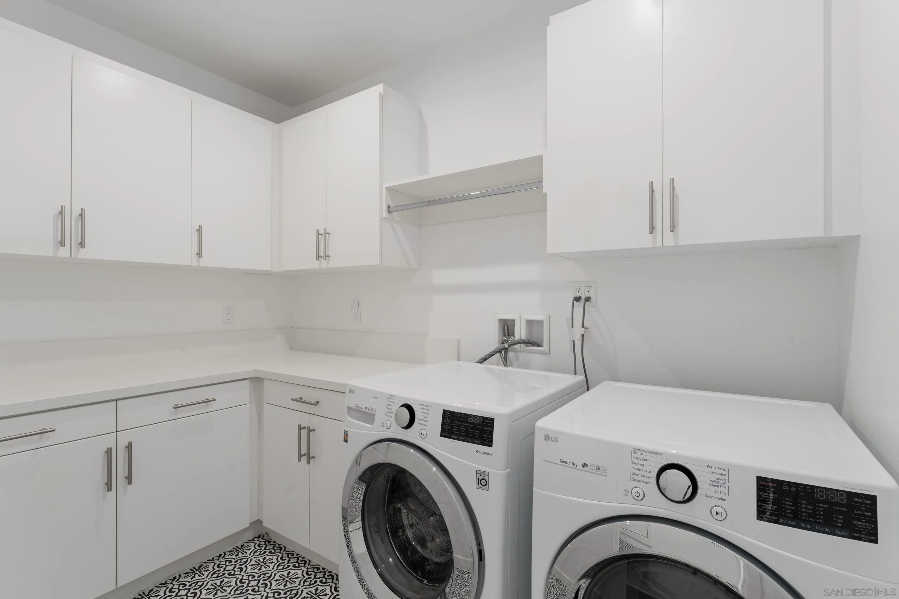 2731 Via Avella San Diego, CA 92108 - Photo 16 of 39 a view of storage and utility room with washer and dryer