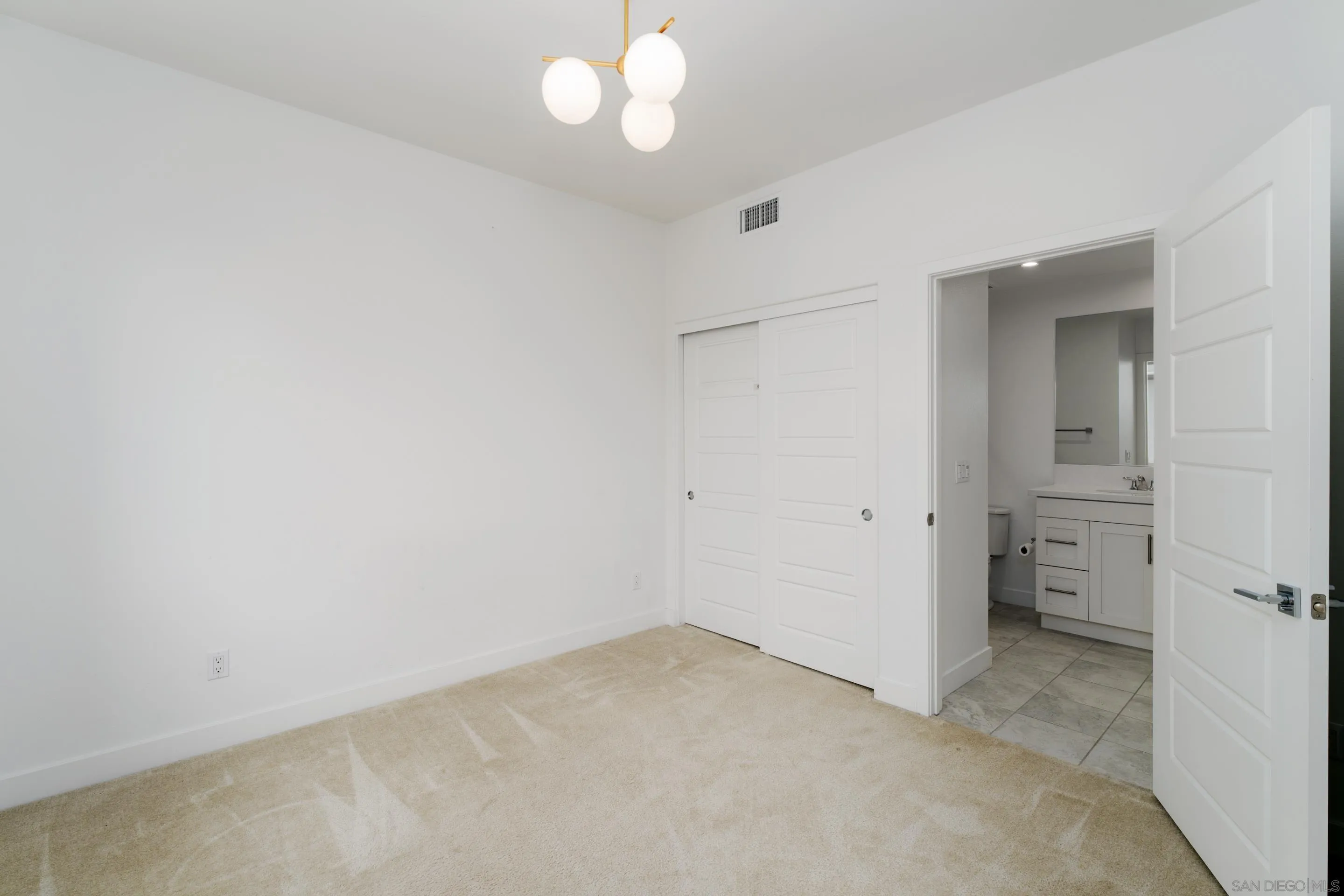 2731 Via Avella San Diego, CA 92108 - Photo 17 of 39 an empty room with a bathroom